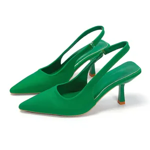 Side view of vibrant green slingback high heels with pointed toe and slim stiletto heel.