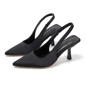 Elegant black pointed-toe slingback heels with minimalist design and kitten heel
