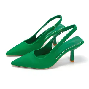 Elegant green pointed-toe slingback high heels with slender heels on white background.