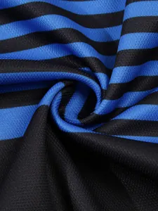 Close-up of breathable blue and black striped fabric texture for polo shirt