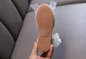 Detailed view of the durable non-slip rubber sole on elegant girls princess dance shoes