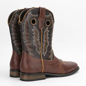 Rear view of brown vintage men's cowboy boots with classic embroidery details