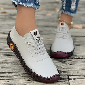 Close-up view of white handmade casual loafers for women with a soft and flexible sole