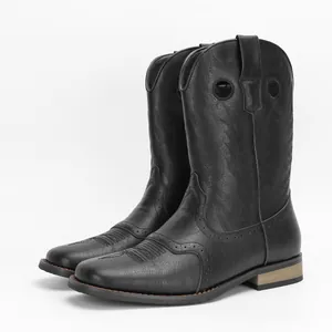Side view showing intricate embroidery details on black leather western cowboy boots