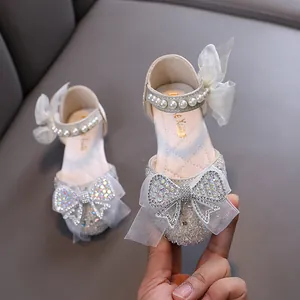 Elegant girls' rhinestone princess shoes with decorative pearls and bows for formal dance events