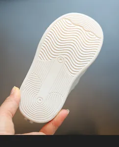 Close-up of white soft anti-slip rubber sole for children indoor kindergarten shoes