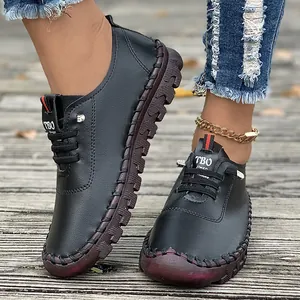 Casual black women's flat shoes with handmade stitching and soft rubber soles