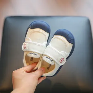 Toddler indoor sneakers with soft soles and velcro strap in navy and white color
