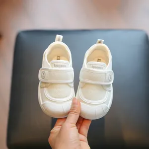 Breathable white kids indoor sneakers with soft soles and adjustable velcro straps