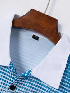 Macro view of white collar and blue polka dot pattern detail on men's casual polo shirt