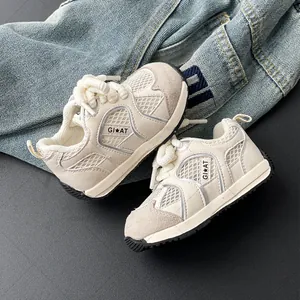 Breathable beige baby sneakers featuring athletic mesh design and flexible soft rubber sole