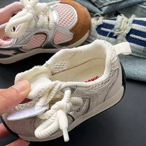 Breathable baby mesh sneakers with soft soles for toddlers' walking support.