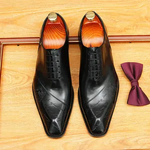 Scarpe Oxford in vera pelle nera premium da uomo con incisioni artigianali eleganti