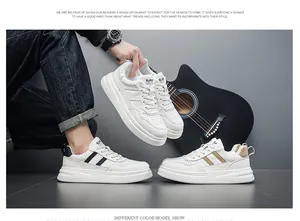 Stylish men's white casual sneakers with diagonal stripes and thick soles lifestyle view