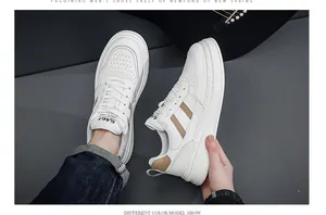 Detailed view of white leather men's sneakers with brown stripes and thick platform soles