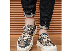 Macro view of men's casual shoes featuring a detailed woven cartoon bear tapestry pattern