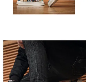 Close-up of men's denim slip-on shoes with cartoon bear pattern and thick white soles.