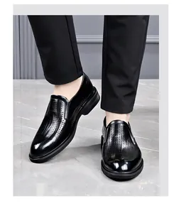 Detail view of men's black perforated slip-on formal shoes with breathable hollow design
