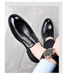 Close-up of black hollow breathable men's formal leather shoes for business wear