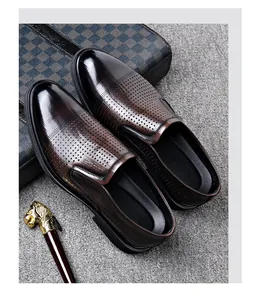 Detailed macro view of brown hollow breathable business dress shoes for men with pointed toe