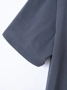 Close-up of grey short sleeve cuff showing double stitching detail on soft cotton Polo shirt