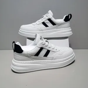 Detailed view of men's leather sneakers with thick sole and black stripes