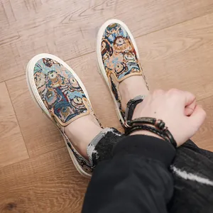Stylish men's slip-on casual shoes with cute cartoon bear pattern on wooden floor