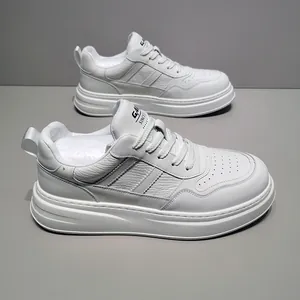 Detailed side view of white leather thick-sole sneakers with striped pattern