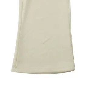 Detail of flared leg opening with double stitching on men's cream leisure pants