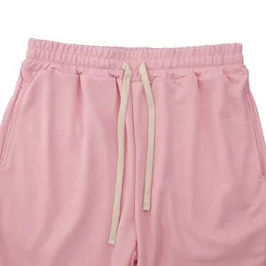 Close-up detail of pink heavyweight drawstring casual pants featuring elastic waistband
