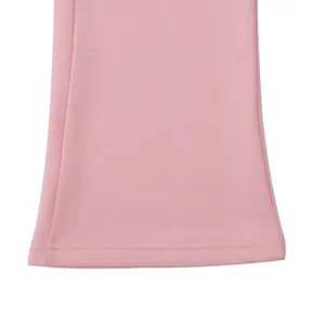 Close-up detail of pink flared pants hem showing high-quality stitching and fabric texture