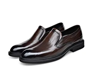 Professional side view of brown leather slip-on dress shoes with grid embossed pattern