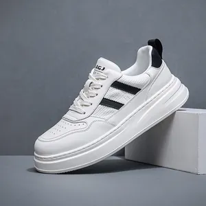 Professional men's white genuine leather sneakers with thick sole and black accent stripes.
