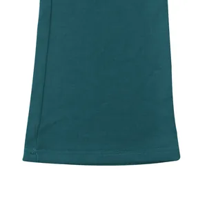 Close-up of the flared hem and stitching on teal heavyweight cotton casual trousers.