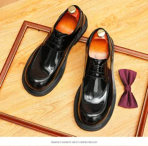 Top view of high-shine black men's leather Derby shoes with decorative wooden frame