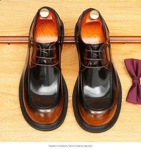 Detailed top-down view of men's brown gradient leather derby shoes with wooden shoe trees