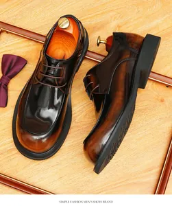 Classic vintage brown leather round toe Derby shoes for men on rustic wooden background