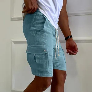 Detailed view of men's blue cargo shorts featuring a drawstring and side pockets