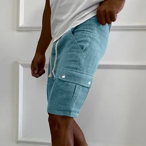 Detailed view of men's blue cargo shorts with side pocket and drawstring waist.