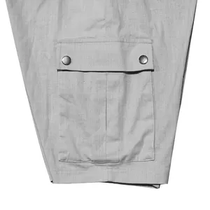 Close-up of side cargo pocket on gray men's slim fit lightweight shorts