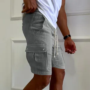 Side view detail of men's grey cargo shorts with drawstring and pockets.