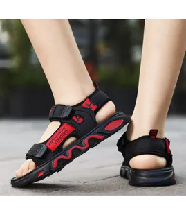 Detailed macro shot of boys' lightweight black and red sandals with a soft non-slip sole