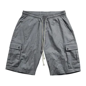 Front view of premium grey men's cargo shorts with drawstring and flap pockets detail