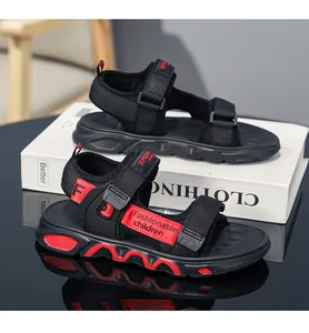 Detailed macro view of lightweight boys' sandals with red wave patterned soft soles