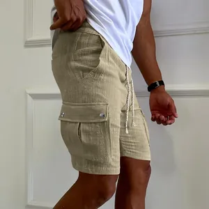 Side view of mens khaki drawstring cargo shorts featuring a functional side pocket