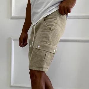Close-up detail of men's slim fit khaki cargo shorts with side pockets and textured fabric