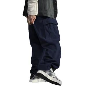 Side view of men's navy blue corduroy cargo pants featuring a large utility side pocket.