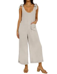 Women's linen-blend wide-leg jumpsuit with deep U-neck and adjustable shoulder ties