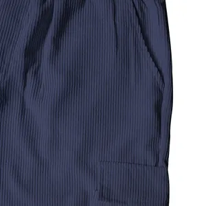Detailed macro view of dark navy blue corduroy fabric and cargo pocket texture