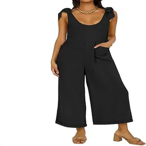 Elegant women's black wide-leg jumpsuit with tie shoulder straps and deep U-neckline
